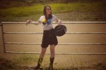 Cowgirl with a black hat and a rocker tee