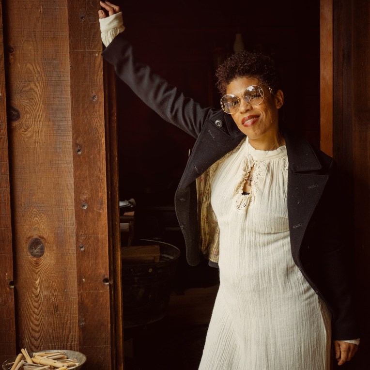 Model leaning on the door post wearing Chloe sunglasses at the stagecoach inn in Newbury Park ca