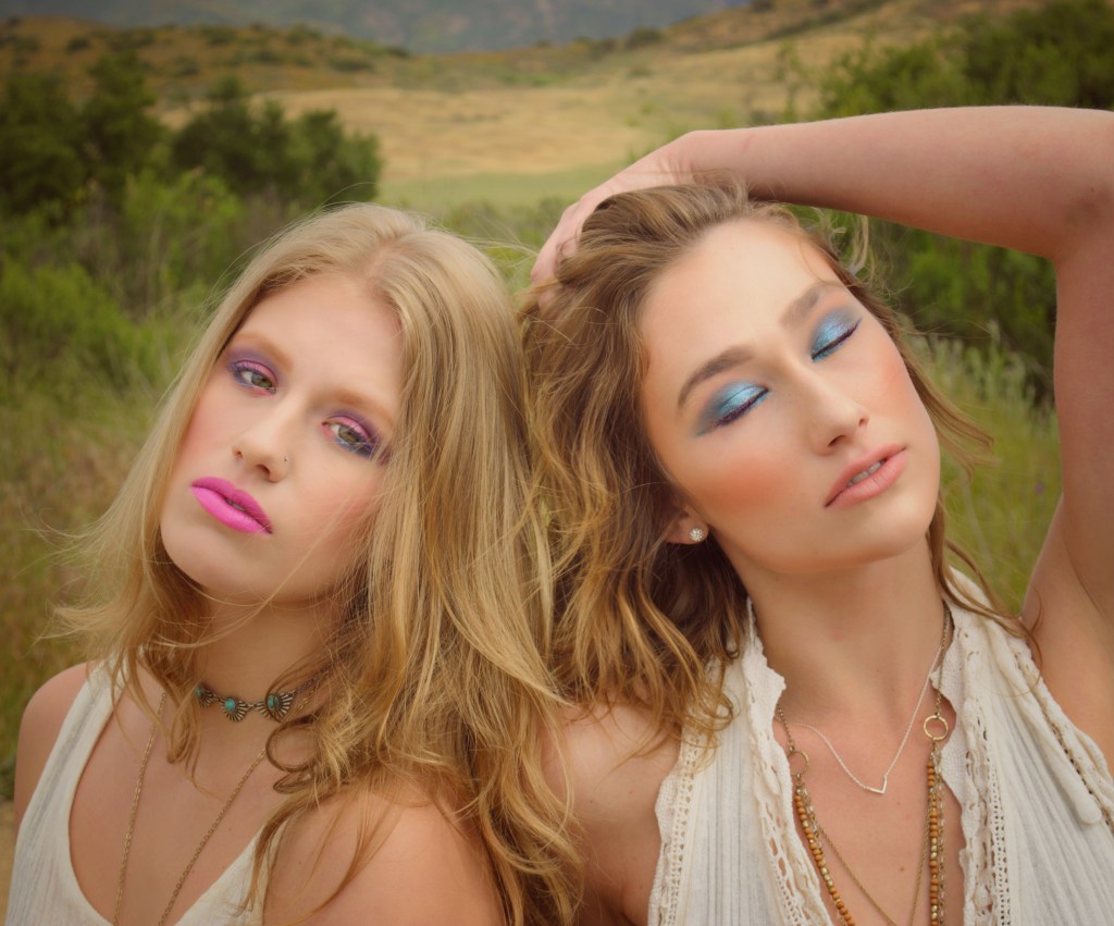 Portrait of 2 young women in front of a scenic Mountain View 