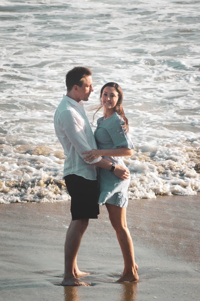 Couple hugging on the beach