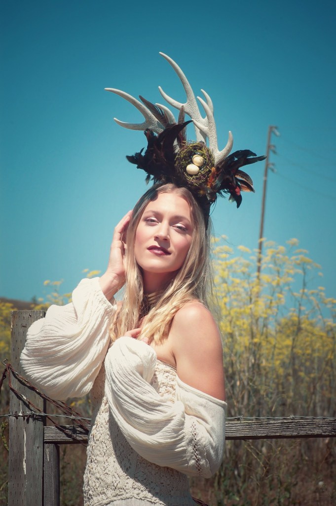 Woman with head piece blue sky